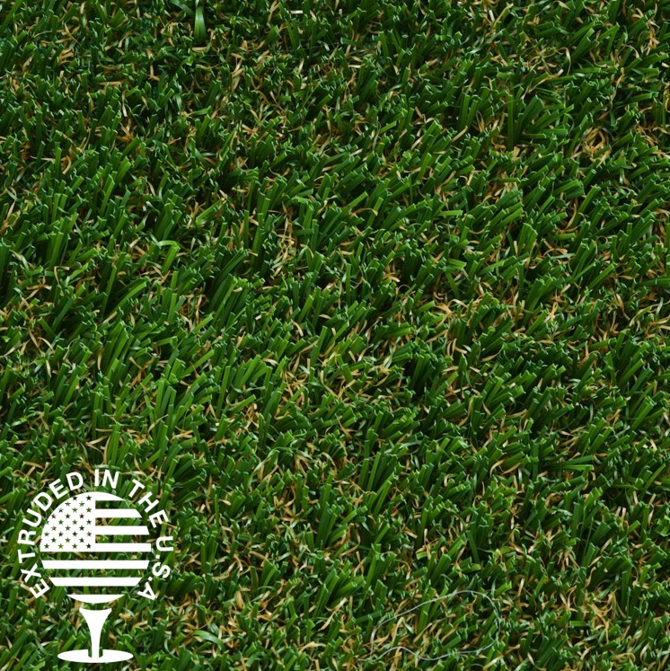 Close up image of green artificial grass with some brown fiber strands.