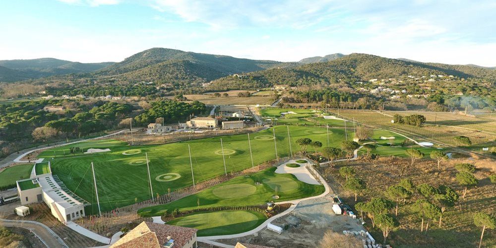 Fresno Aerial view of a synthetic grass golf course surrounded by hills