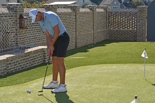 Fresno Golfer putting on synthetic grass